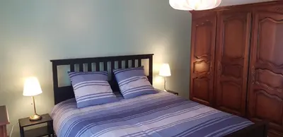 Un ou plusieurs lits dans un hébergement de l'établissement Lodge-Sagne une ferme rénovée au cœur du Cantal à proximité de la station de ski du Lioran