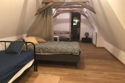 Un ou plusieurs lits dans un hébergement de l'établissement Chez Rénou et Prospérou maison typique du Sarladait