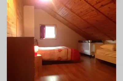 Un ou plusieurs lits dans un hébergement de l'établissement Chalet en pleine nature pour 12 personnes