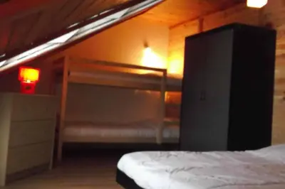 Un ou plusieurs lits dans un hébergement de l'établissement Chalet en pleine nature pour 12 personnes