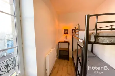 Un ou plusieurs lits dans un hébergement de l'établissement CLIM Jolie maison de 60 m2 avec jardin