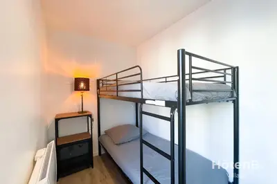 Un ou plusieurs lits dans un hébergement de l'établissement CLIM Jolie maison de 60 m2 avec jardin