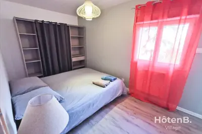 Un ou plusieurs lits dans un hébergement de l'établissement CLIM Jolie maison de 60 m2 avec jardin