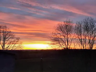 Lever ou coucher de soleil vu de la maison de vacances ou à proximité