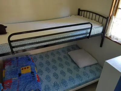 Un ou plusieurs lits dans un hébergement de l'établissement Chalets et mobilhomes les Tourterelles