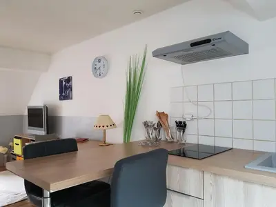 Cuisine ou kitchenette dans l'établissement Appartement cosy pour une pause sereine et chaleureuse