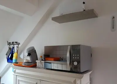 Cuisine ou kitchenette dans l'établissement Appartement cosy pour une pause sereine et chaleureuse