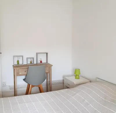 Un ou plusieurs lits dans un hébergement de l'établissement Appartement cosy pour une pause sereine et chaleureuse