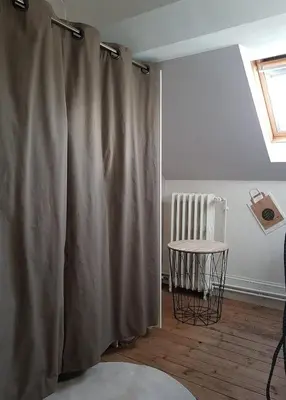 Un ou plusieurs lits dans un hébergement de l'établissement Appartement cosy pour une pause sereine et chaleureuse