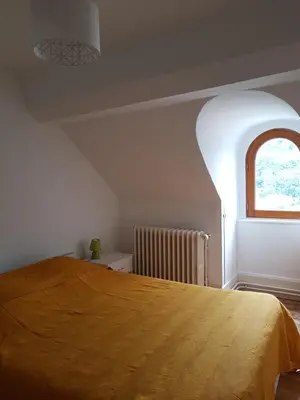 Un ou plusieurs lits dans un hébergement de l'établissement Appartement cosy pour une pause sereine et chaleureuse