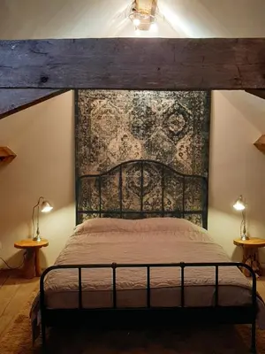 Un ou plusieurs lits dans un hébergement de l'établissement Luxe gîte met authentieke kamers in de Creuse, France