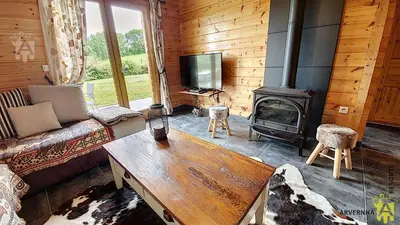 Télévision ou salle de divertissement dans l'établissement Chalet Lorine