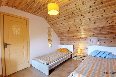 Un ou plusieurs lits dans un hébergement de l'établissement Chalet Lorine