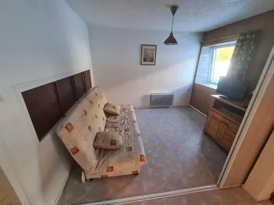 Un ou plusieurs lits dans un hébergement de l'établissement bel appartement du sancy