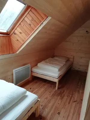 Un ou plusieurs lits dans un hébergement de l'établissement Gîte Granit des Fraux