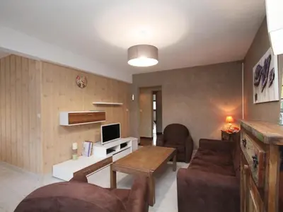 Télévision ou salle de divertissement dans l'établissement Bel appartement T4 au Mont-Dore - Wifi inclus - FR-1-608-9
