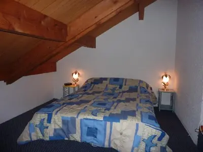 Un ou plusieurs lits dans un hébergement de l'établissement Duplex au Mont-Dore avec Wifi et Parking privatif - FR-1-608-51