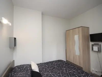 Un ou plusieurs lits dans un hébergement de l'établissement Charmant T2 hyper centre Mont-Dore avec WIFI - FR-1-608-63