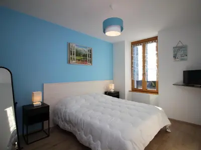 Un ou plusieurs lits dans un hébergement de l'établissement Appartement T3 Confortable avec Parking et WiFi au Mont-Dore - FR-1-608-87