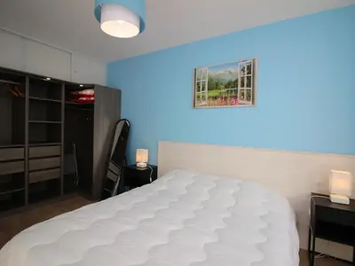 Un ou plusieurs lits dans un hébergement de l'établissement Appartement T3 Confortable avec Parking et WiFi au Mont-Dore - FR-1-608-87