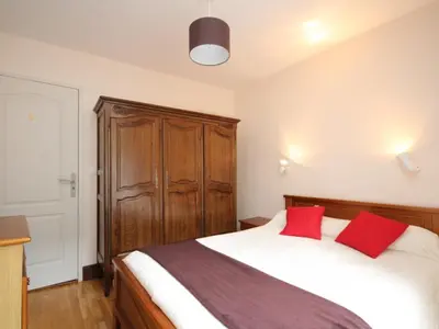 Un ou plusieurs lits dans un hébergement de l'établissement Mont-Dore T2 avec balcon et accès WIFI pour 4 personnes - FR-1-608-86