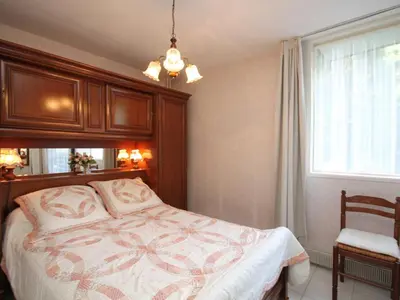 Un ou plusieurs lits dans un hébergement de l'établissement Mont-Dore T2 avec balcon et parking - FR-1-608-117