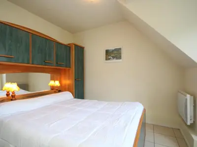 Un ou plusieurs lits dans un hébergement de l'établissement T2 agréable au Mont-Dore avec terrasse pour 4 personnes - FR-1-608-146