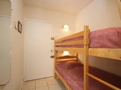 Un ou plusieurs lits superposés dans un hébergement de l'établissement T2 agréable au Mont-Dore avec terrasse pour 4 personnes - FR-1-608-146