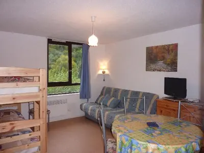 Télévision ou salle de divertissement dans l'établissement Studio cosy au Mont-Dore, proche centre avec parking - FR-1-608-122