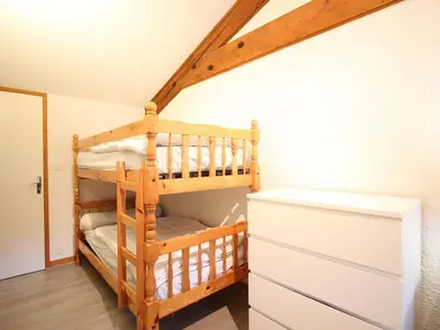Un ou plusieurs lits dans un hébergement de l'établissement Mont-Dore Duplex 35m², Balcon, Wi-Fi, 6pers - FR-1-608-156