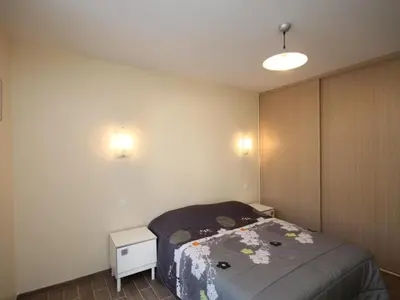 Un ou plusieurs lits dans un hébergement de l'établissement Grand T3 au Mont-Dore avec Terrasse et Parking - FR-1-608-177