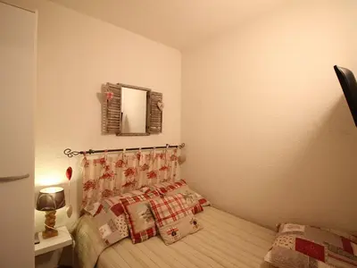 Un ou plusieurs lits dans un hébergement de l'établissement Appartement T3 avec Terrasse et Wifi au Mont-Dore - FR-1-608-178
