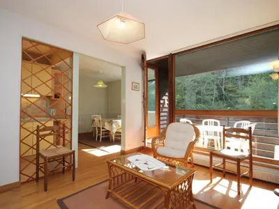 Coin salon dans l'établissement Beau duplex 3 pièces avec balcon, parking et wifi au Mont Dore - FR-1-608-187