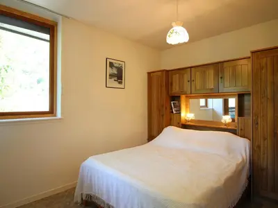 Un ou plusieurs lits dans un hébergement de l'établissement Mont-Dore T2 avec Balcon et Garage Privé - FR-1-608-133