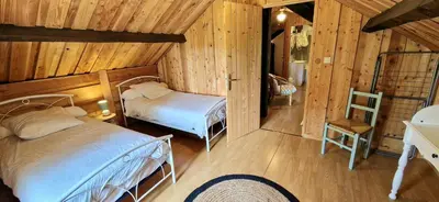 Un ou plusieurs lits dans un hébergement de l'établissement Maison d'hôtes Ourdeaux et Gite Chez Rouchon