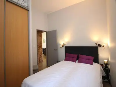 Un ou plusieurs lits dans un hébergement de l'établissement LE MONT DORE - Appartement T3 spacieux avec balcon et WIFI au centre - FR-1-608-23