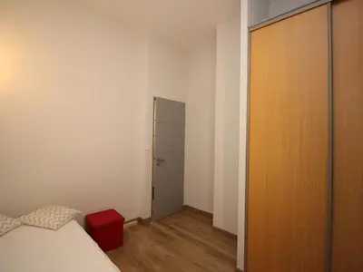 Un ou plusieurs lits dans un hébergement de l'établissement LE MONT DORE - Appartement T3 spacieux avec balcon et WIFI au centre - FR-1-608-23