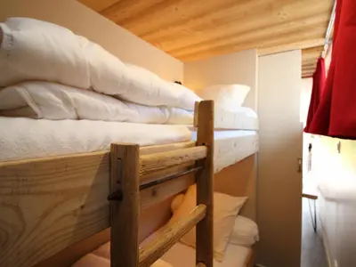 Un ou plusieurs lits dans un hébergement de l'établissement Le Mont-Dore, T3 rénové avec jardin privé et parking, accès wifi - FR-1-608-37