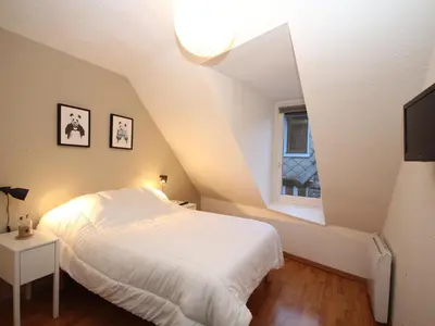Un ou plusieurs lits dans un hébergement de l'établissement Mont-Dore: Beau T3 bis hyper centre avec wifi - FR-1-608-42