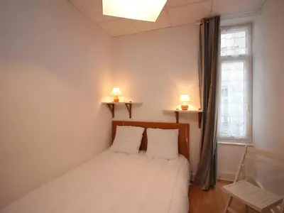 Un ou plusieurs lits dans un hébergement de l'établissement Appartement lumineux à La Bourboule, 3 chambres, proche centre - FR-1-608-39