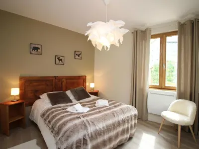 Un ou plusieurs lits dans un hébergement de l'établissement LE MONT DORE - Appartement T3 avec terrasse, parking et wifi - FR-1-608-79