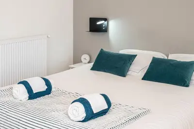 Un ou plusieurs lits dans un hébergement de l'établissement SOTHYS Design Apartment 7 min from Limoges