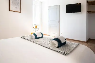Un ou plusieurs lits dans un hébergement de l'établissement SOTHYS Design Apartment 7 min from Limoges