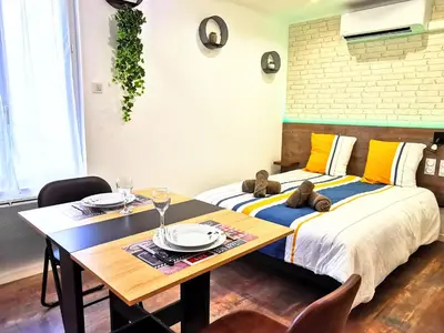 Un ou plusieurs lits dans un hébergement de l'établissement Skyline Residence 