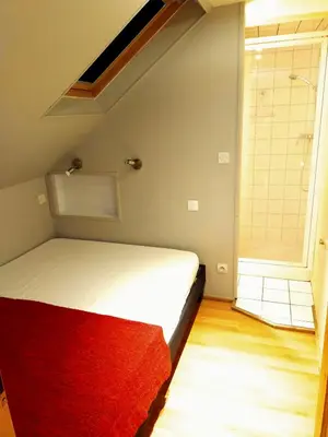 Un ou plusieurs lits dans un hébergement de l'établissement Duplex de 65 m² à l'esprit chalet
