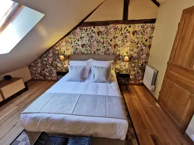 Un ou plusieurs lits dans un hébergement de l'établissement Maison d'hôtes Les jardins Saint Eloi