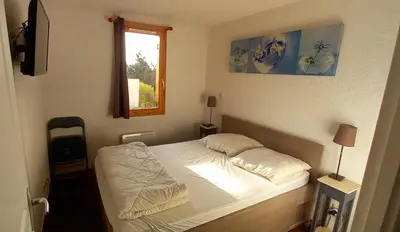 Un ou plusieurs lits dans un hébergement de l'établissement superbesse Appartement 4-6 pers. 2 ch. Dans résidence 3 étoile avec piscine