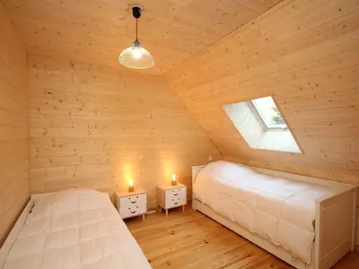 Un ou plusieurs lits dans un hébergement de l'établissement Splendide chalet 5 chambres avec terrasse, garage et wifi au Mont-Dore - FR-1-608-188