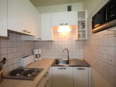 Cuisine ou kitchenette dans l'établissement Charmant T2 Mont-Dore avec WiFi et Parking - FR-1-608-193