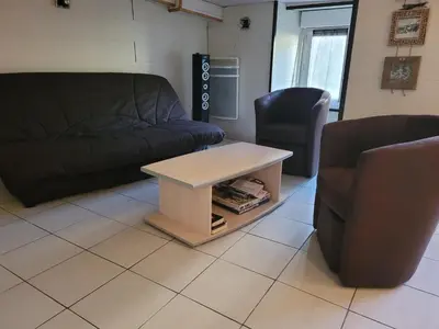 Coin salon dans l'établissement CURE THERMALE OU VACANCES D'ETE AU MONT DORE